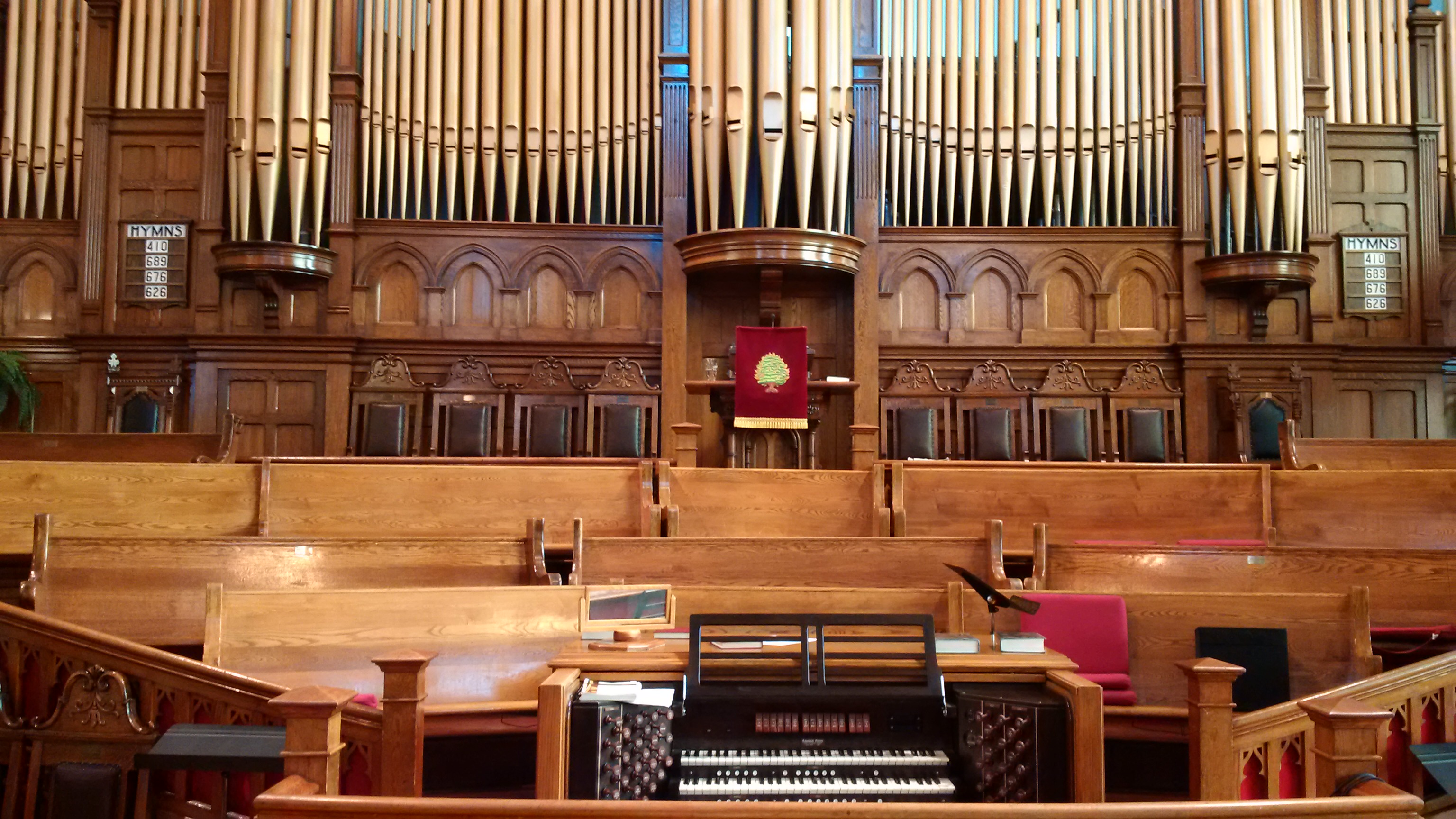 The 1909 Casavant organ pipes above the pulpit and choir loft
