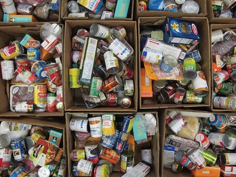 Cardboard boxes filled with donated tinned and packaged food