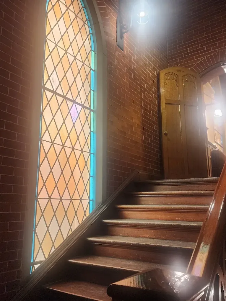 Light falling through the stained-glass window in the stairwell