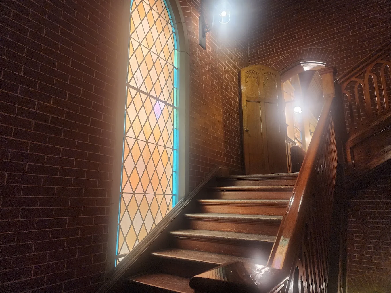 Light falling through the stained-glass window in the stairwell